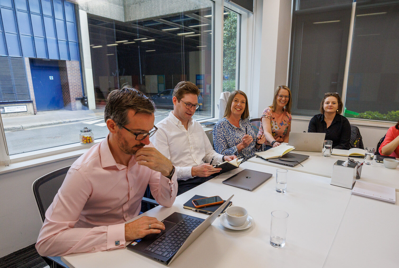 equantiis team members in office meeting